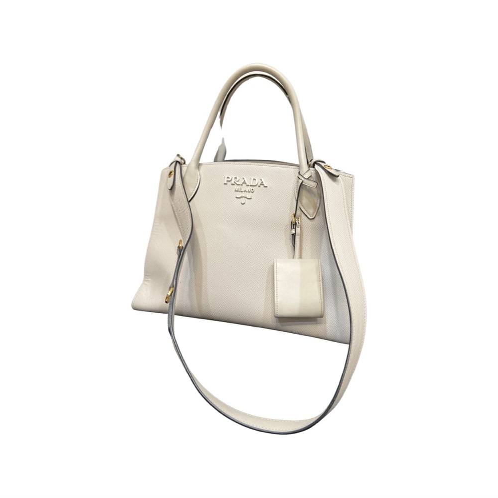 Prada Tote
White Leather
Gold-Tone Hardware
Rolled Handles
Logo Jacquard Lining